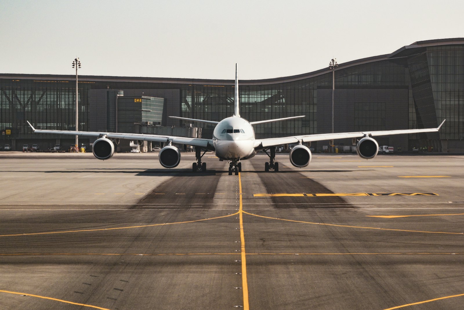 A wide-body aircraft parked at an airport terminal
