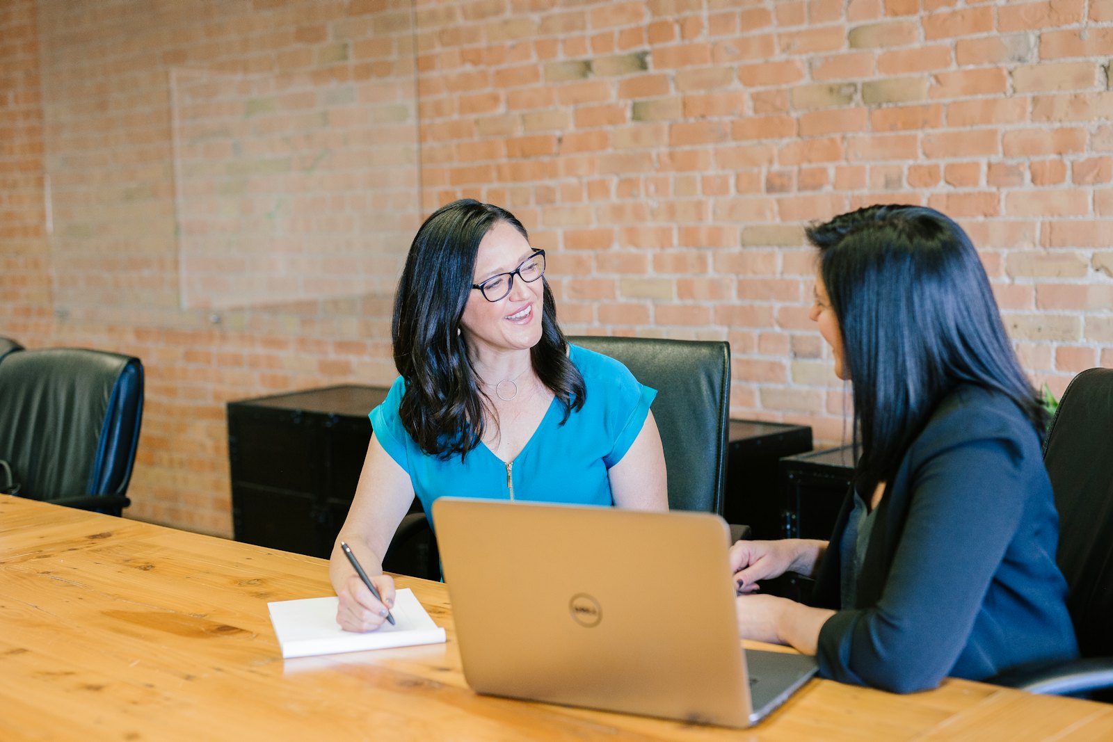 An adviser meeting a client across a desk